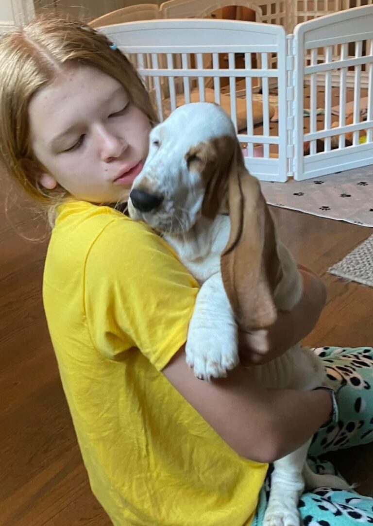 Grace Whitcomb with their basset hound